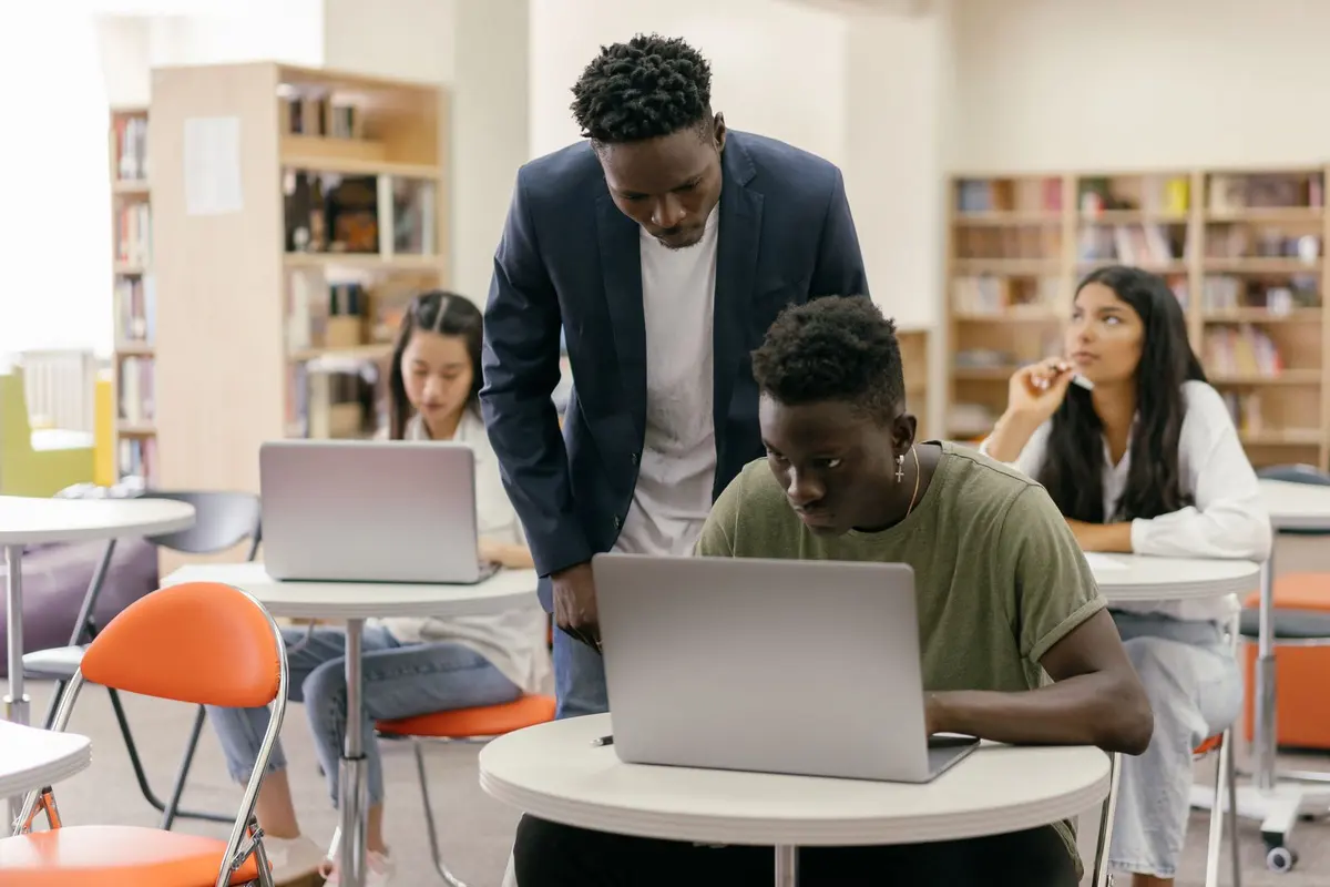 Students learning digital marketing on laptops