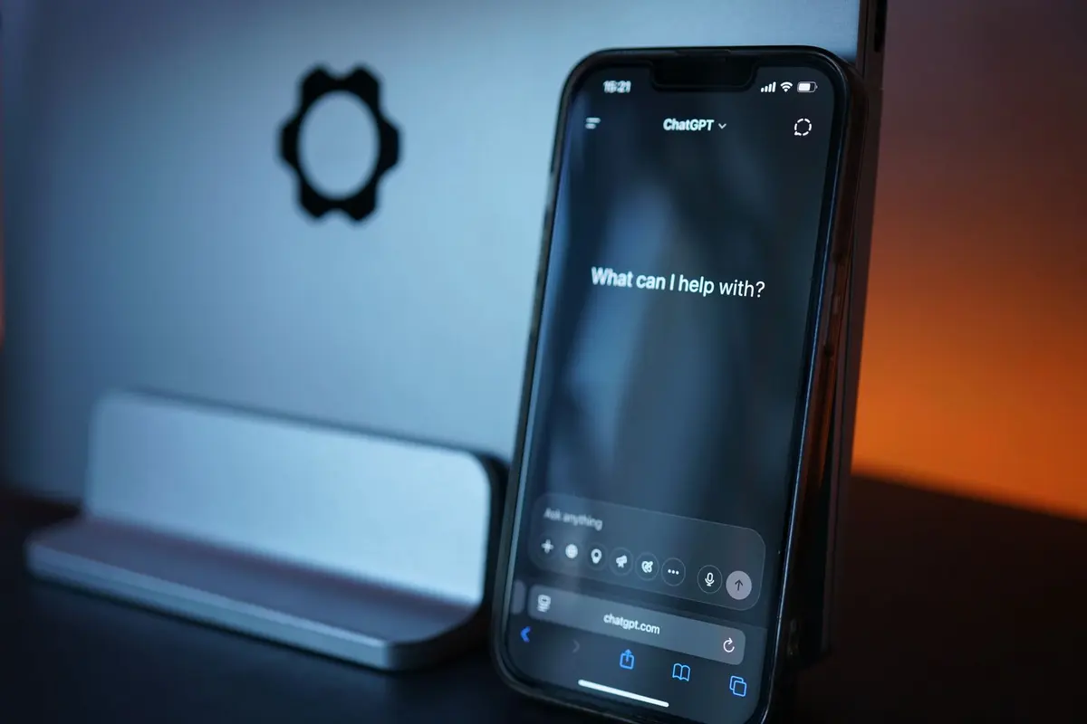AI Agent Development Company in Salem - Customer chatting with an AI assistant on a smartphone