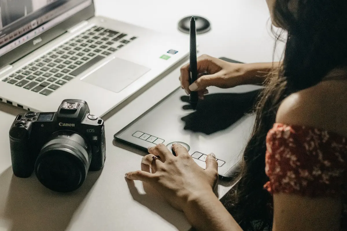 Graphic Design Company in Salem - Graphic designer working on a drawing tablet