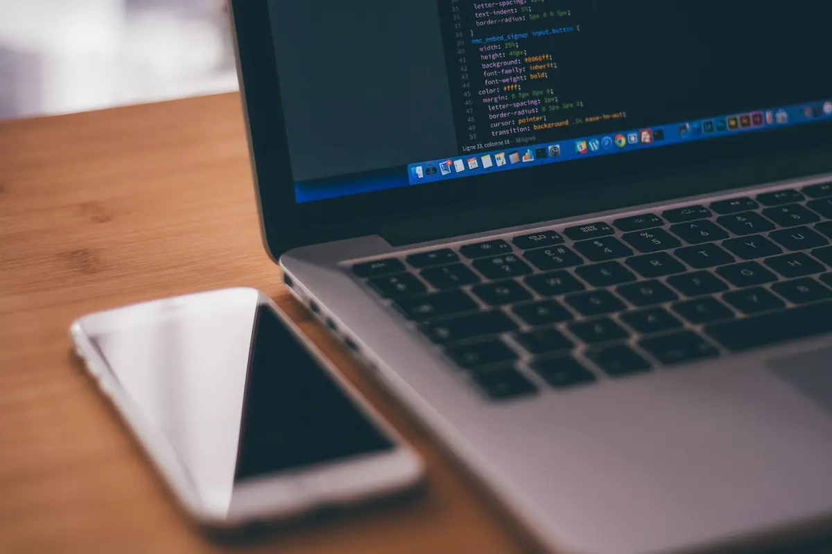 Mobile App Development Company in Salem - Smartphone screen showing app code during development