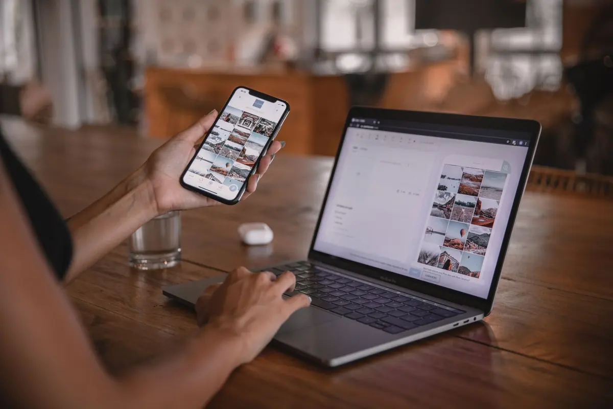 Social Media Management Services in Salem - Managing business social media content on a phone and laptop