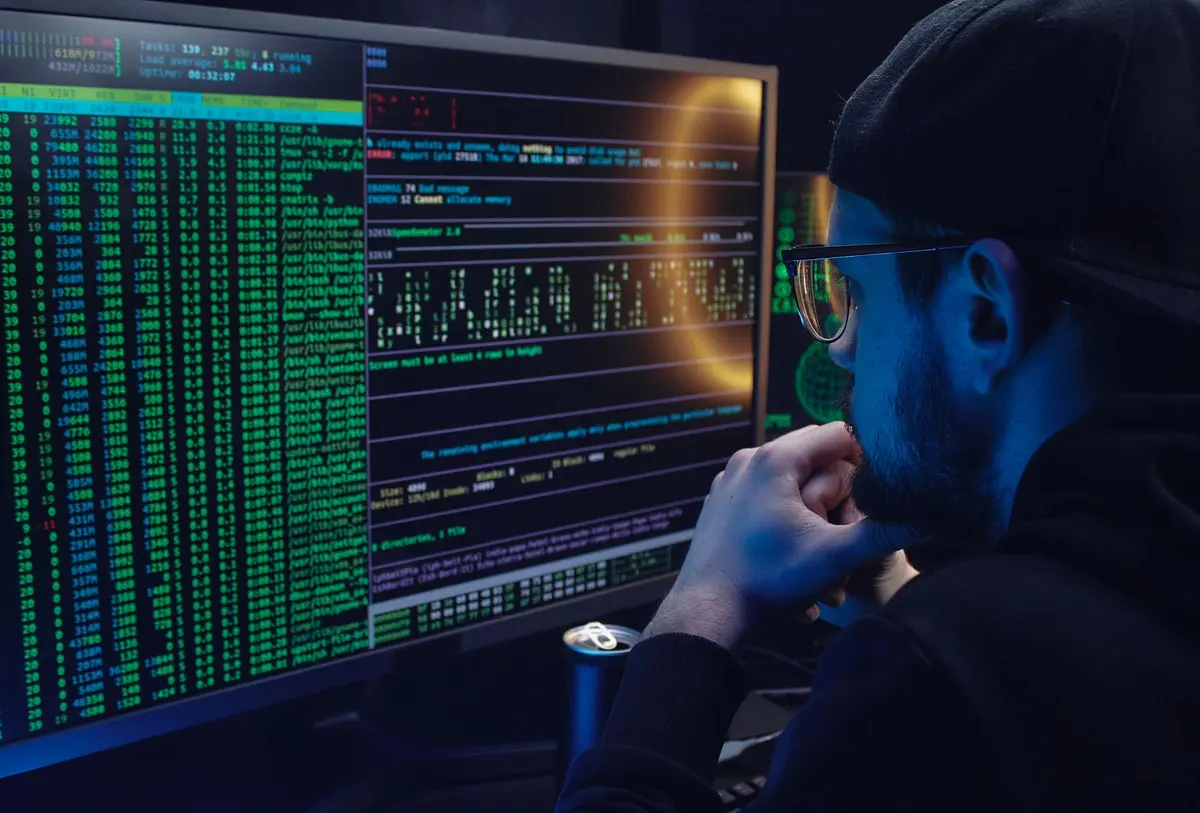 Website Maintenance Services in Salem - Developer monitoring website code on dual monitors
